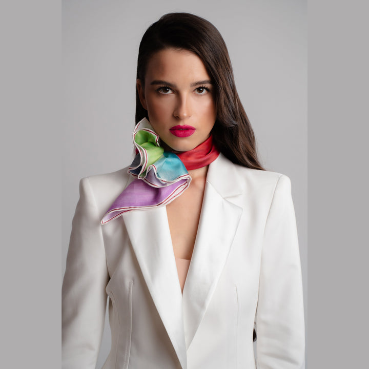 How To Style Silk Scarf on Neck with white blazer MOM & DAUGHTER LOVE STORY Silk Art-A-Porte Scarf – 34” x 34” & 21” x 21” Daughter in a red dress and child on a stool kiss each other against a colorful background Art-A-Porte Silk Collection by Fashion Designer Alesia Chaika AlesiaC.com