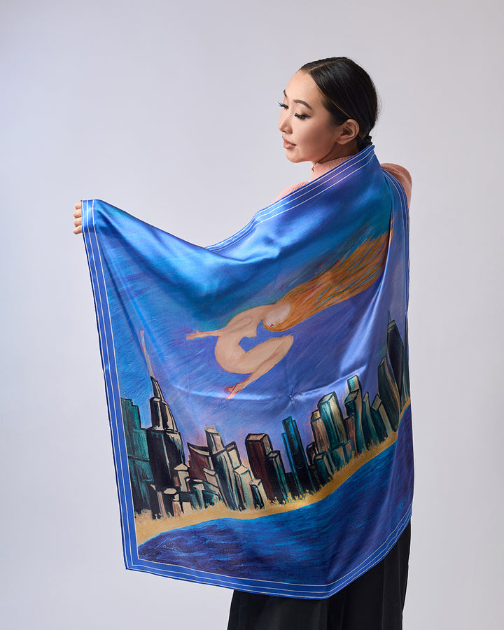 Midnight Muse pure silk scarf by Alesia Chaika, featuring a hand-painted golden muse flying over the Chicago skyline and Lake Michigan in deep blue tones. AlesiaC.com