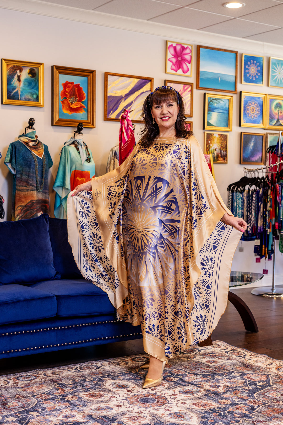 Designer Alesia Chaika in her Alesia C. SERENITY pure silk maxi caftan in a navy blue and gold. AlesiaC.com