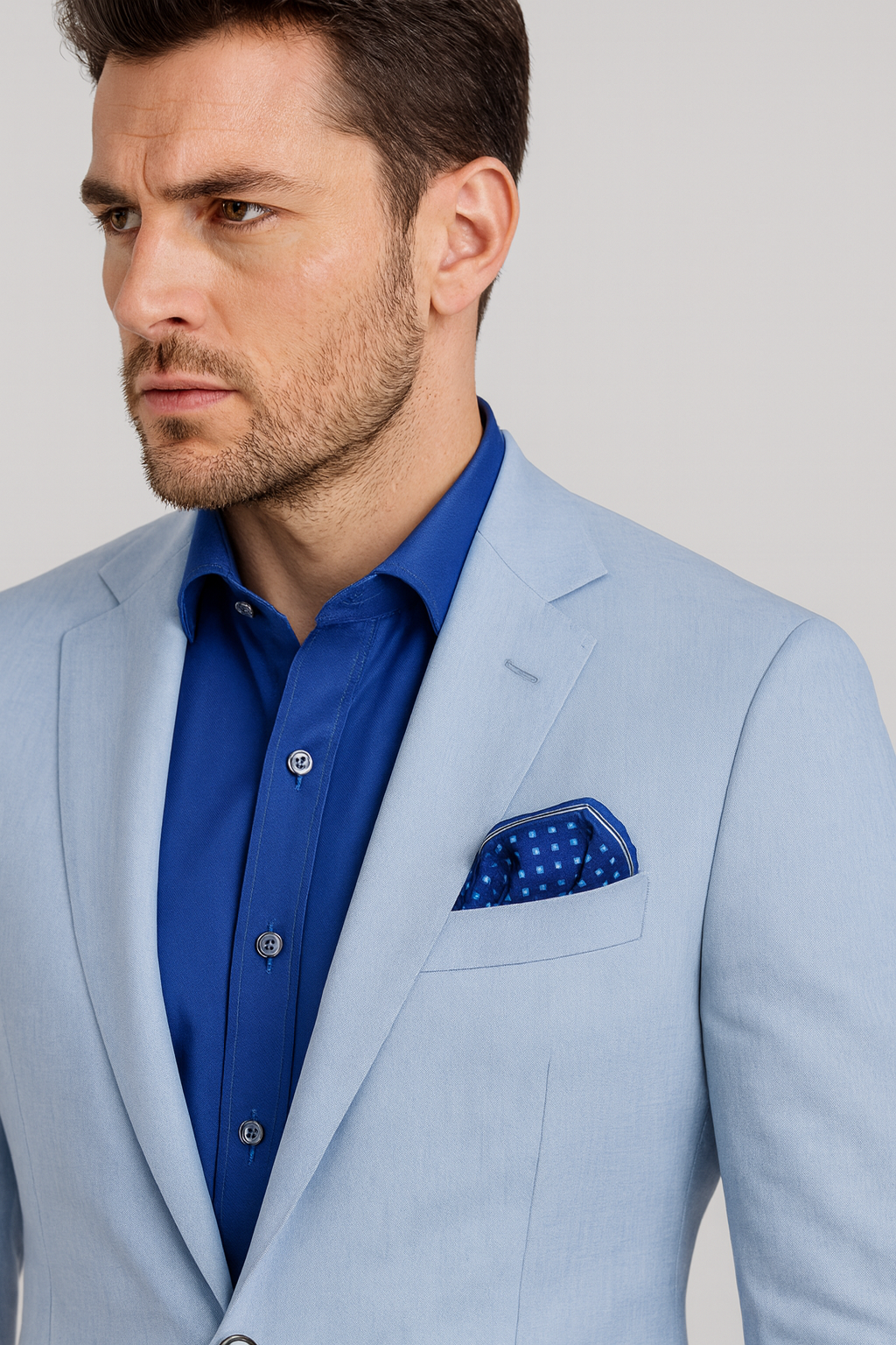 The Architectural Connection Navy and Royal Blue Silk Pocket Square features a refined geometric square motif inspired by the iconic white coffered ceiling of the Field Museum’s Stanley Field Hall. Created from original digital artwork by Chicago-based artist and fashion designer Alesia Chaika in 2013, the design reflects her fascination with architectural harmony and timeless elegance, translated onto pure silk through enduring print techniques. A coffered ceiling is a classic architectural design featur