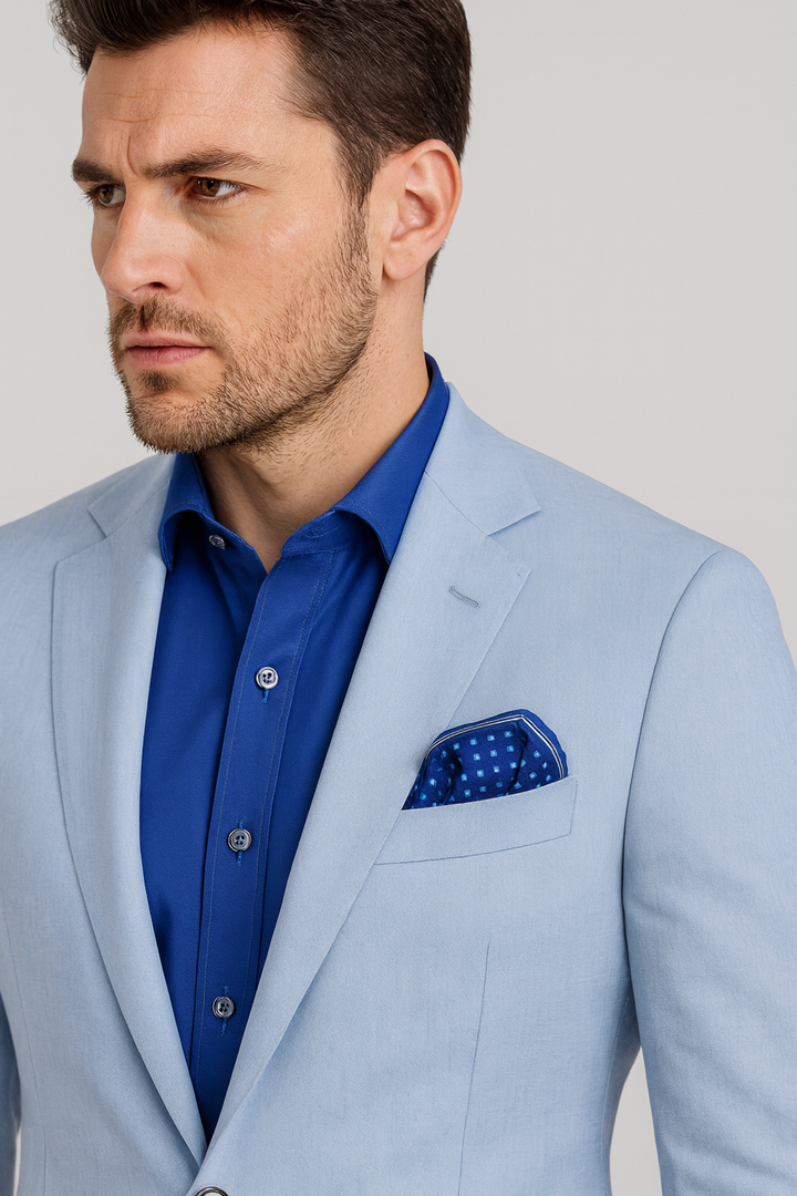 The Architectural Connection Navy and Royal Blue Silk Pocket Square features a refined geometric square motif inspired by the iconic white coffered ceiling of the Field Museum’s Stanley Field Hall. Created from original digital artwork by Chicago-based artist and fashion designer Alesia Chaika in 2013, the design reflects her fascination with architectural harmony and timeless elegance, translated onto pure silk through enduring print techniques. A coffered ceiling is a classic architectural design featur