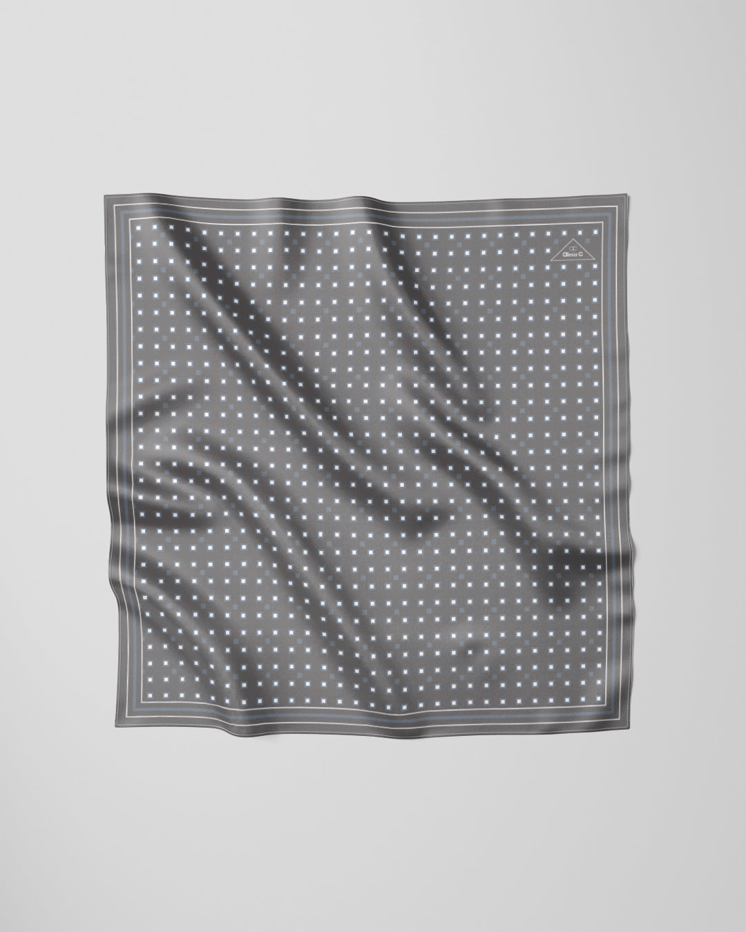 The Architectural Connection Light Gray and White Silk Pocket Square features a refined geometric square motif inspired by the iconic white coffered ceiling of the Field Museum’s Stanley Field Hall. Created from original digital artwork by Chicago-based artist and fashion designer Alesia Chaika in 2013, the design reflects her fascination with architectural harmony and timeless elegance, translated onto pure silk through enduring print techniques. A coffered ceiling is a classic architectural design 