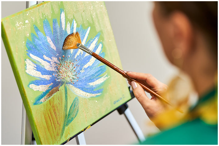 Abstract Cornflower Silk Scarf in Blue and Olive from the Alesia C. Art-A-Porte Collection transforms original fine art into a luxury accessory. The design is reproduced from Alesia Chaika’s acrylic and gold leaf painting, capturing soft blue tones, deep olive, and shimmering gold accents.