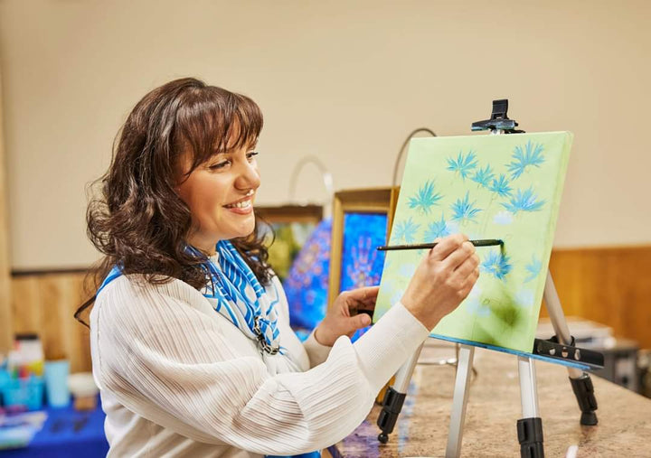 Lake Forest Illinois Based Artist and Fashion Designer Alesia Chaika Painting Blue Cornflowers Dream Artwork On Green Background AlesiaC.com 