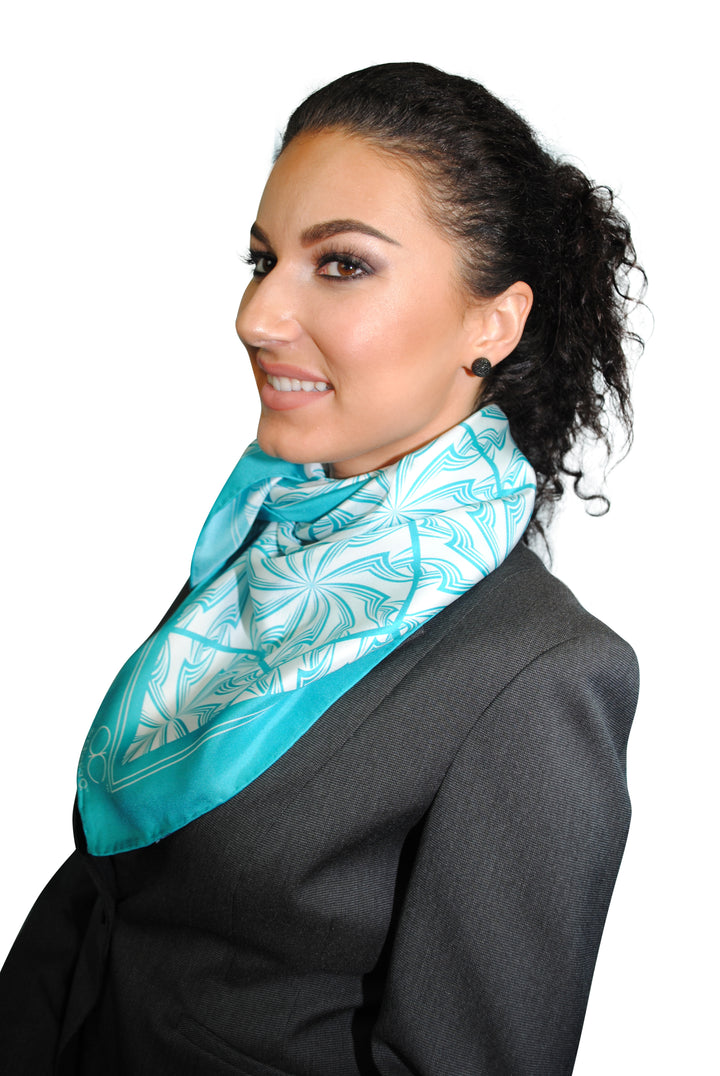 Turquoise Green White DANDELION SNOW Snowflakes Designer Pure Silk Scarf Styled Over Neck and Shoulders With HighLand Scarf Ring in White Gold and Black Strapless Dress AlesiaC.com