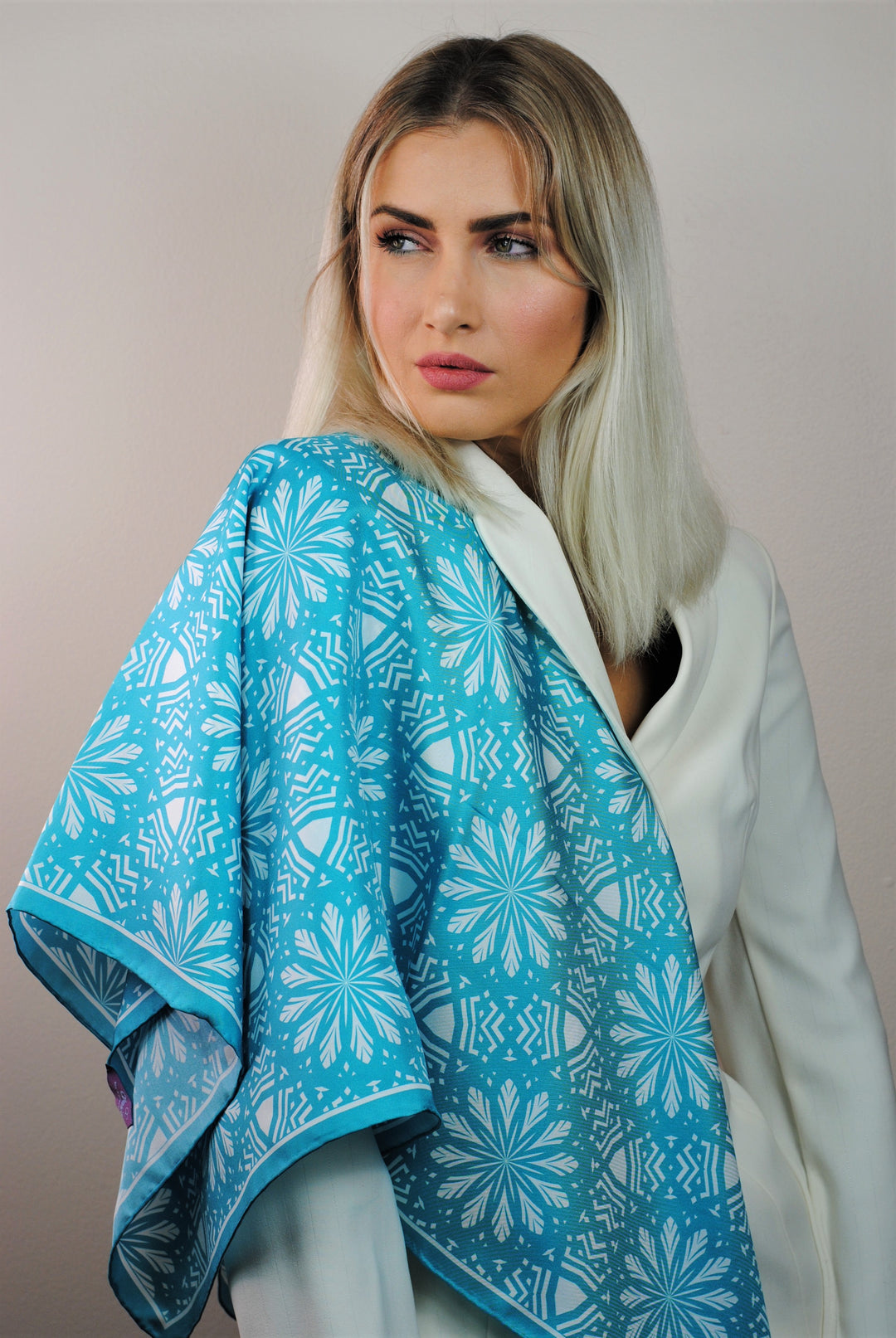 White Snowflakes on Turquoise Aster Mandala 100& Silk Charmeuse Scarf in Green and White Styled On One Shoulder by Alesia Chaika Mandala Collection AlesiaC.com