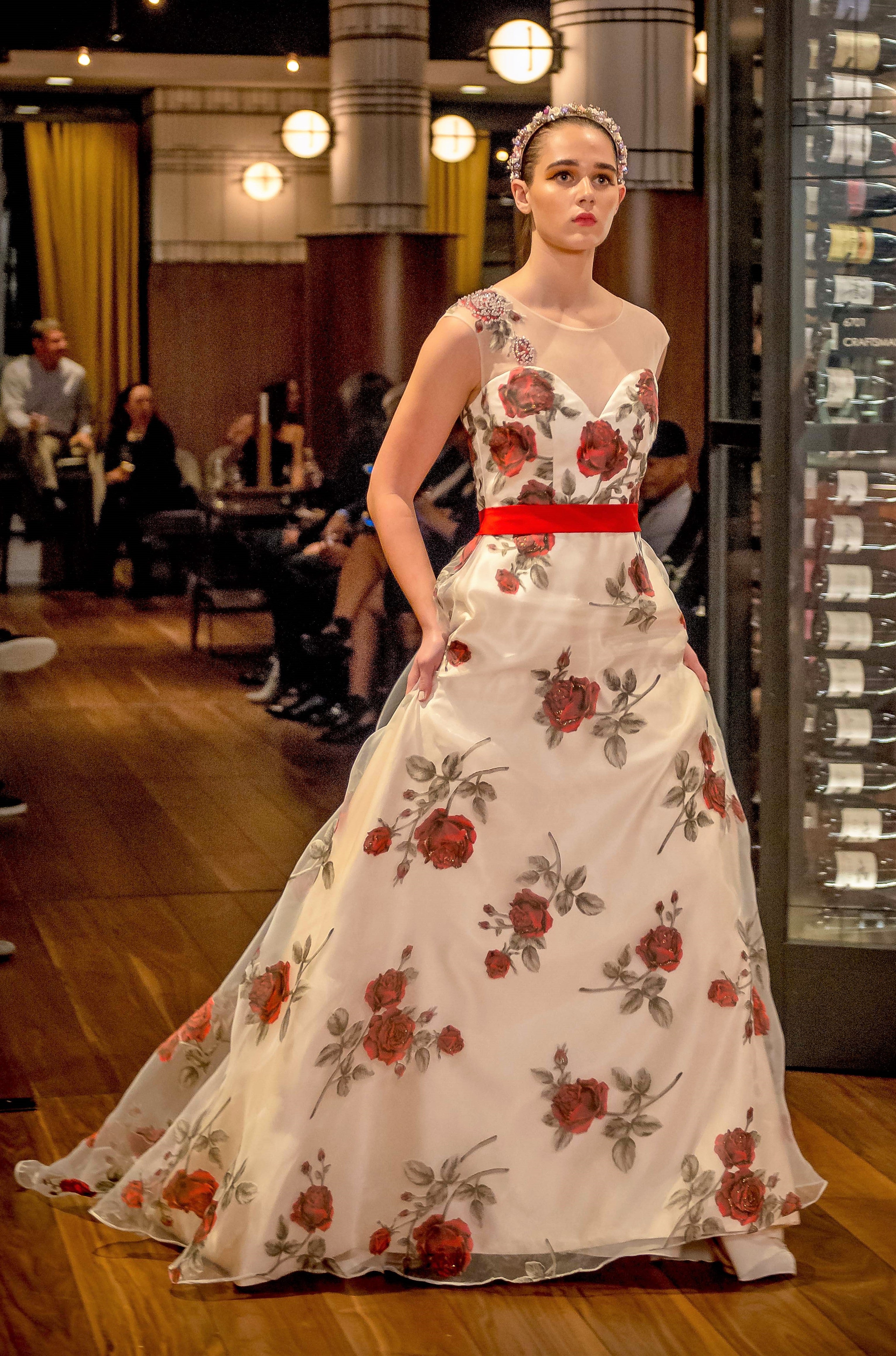 White gown deals with red roses